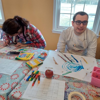 Brady loves painting in Monday group at the Arc of Loudoun