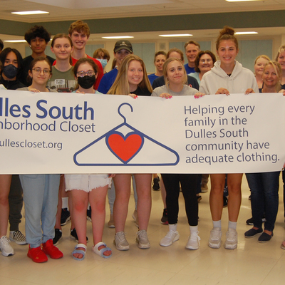 Some of the 400+ youth and adults who volunteered in 2022 seen helping at Lunsford Middle School.