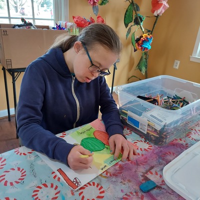 Kelly works hard on a pastel drawing