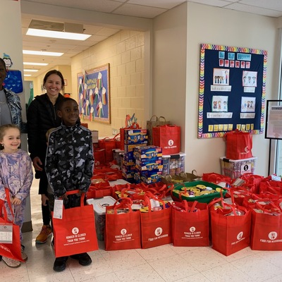 HOPE Preschool donors with red bag donations.