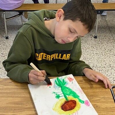 Student at Claude Thompson Elementary, with Barbara Sharp