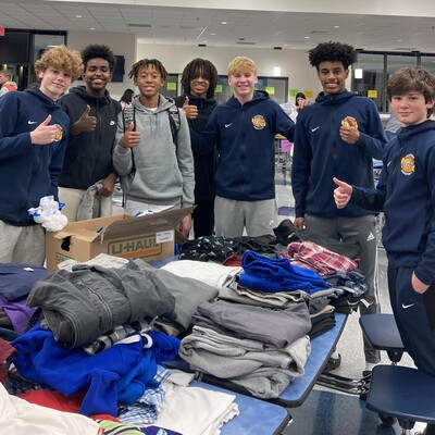 Student volunteers at a Lightridge High School community clothing event in December 2022.