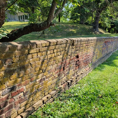 The historic brick wall prior to restoration by AHA