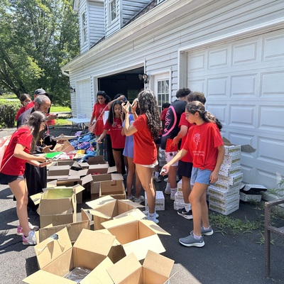 Teen Volunteers Sorting Back to School Supplies