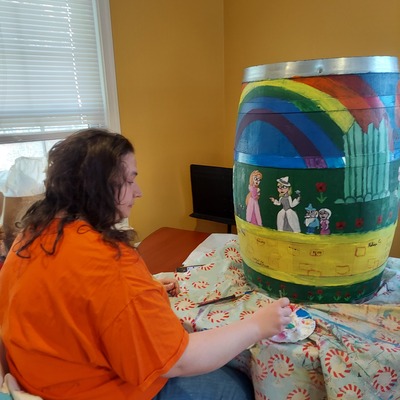 Alicia painting barrel