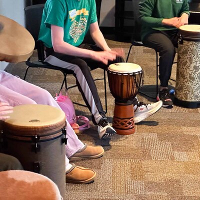 Teens enjoying the power of connecting through music and rhythm at the FORT