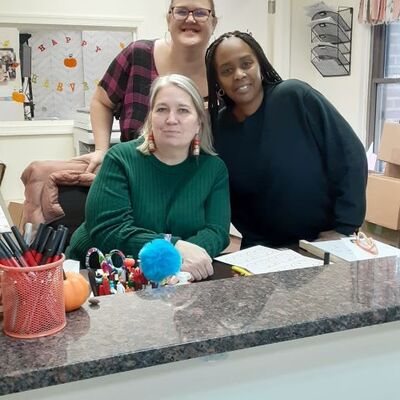 New hire, Cherrell, with her supervisors.