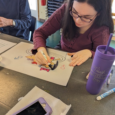 Catherine C drawing freehand in markers