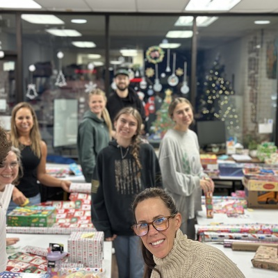Volunteers wrapping over 800 toys for the holidays