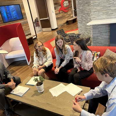 Studens in a small group during the Februrary 2025 Ethical Leadership Conference at QTS Data Centers