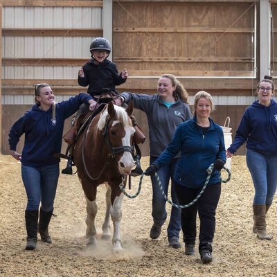 It takes a village to provide a therapeutic riding lesson